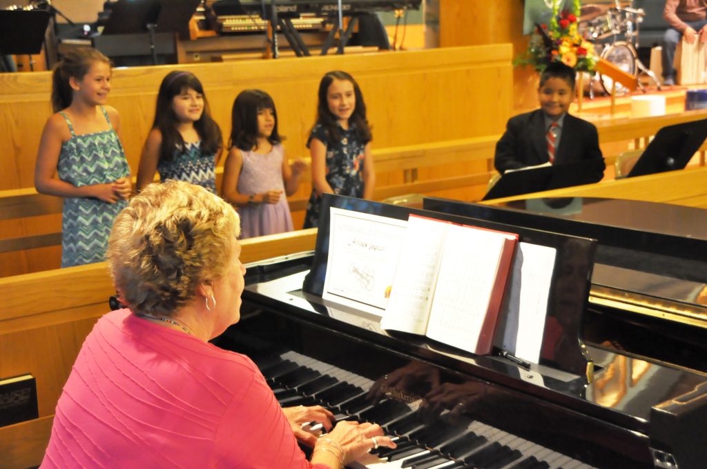 Phyllis Carter, piano teacher, with Anwim students
