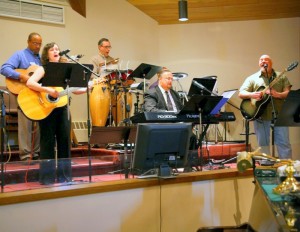 Free Spirit, the NE District praise band, leads worship at a Faith Sharing Event.