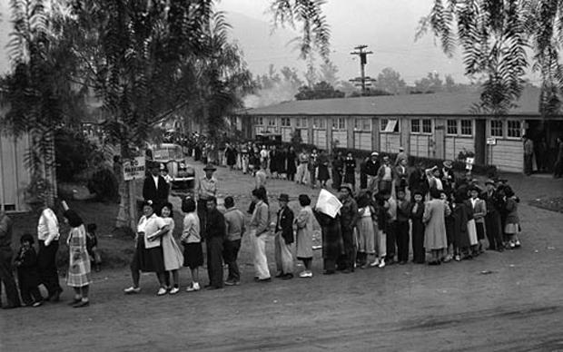 People line up for lunch at Santa Anita Park in April 1942. The park, a converted racetrack, was the United States’ largest assembly center for Japanese Americans on their way to internment camps.