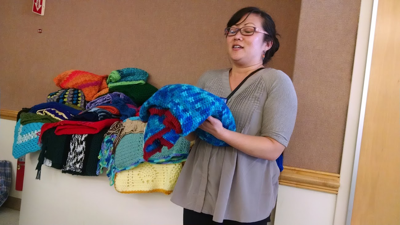 Methodist Hospital Chaplain Joanne Fong offers a prayer of dedication over prayer shawls at a Methodist Hospital Women's Association meeting. (April 26, 2018)